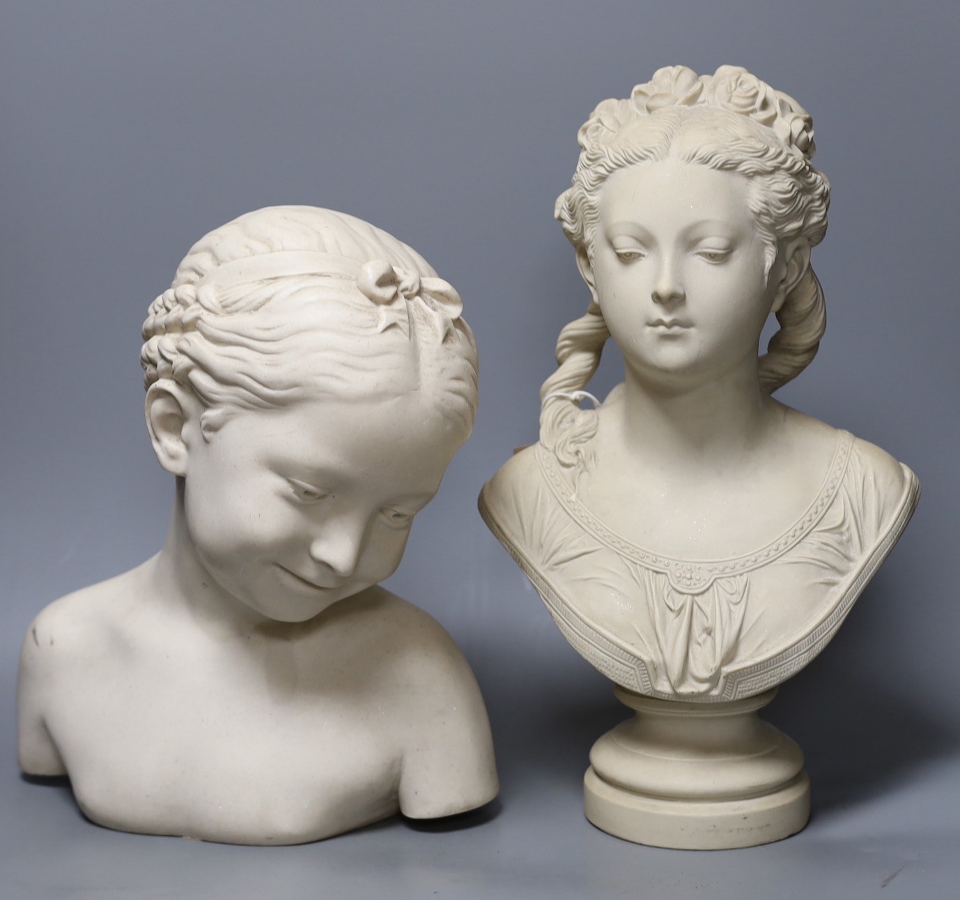 Two period-style resin marble female busts, tallest 39 cms high